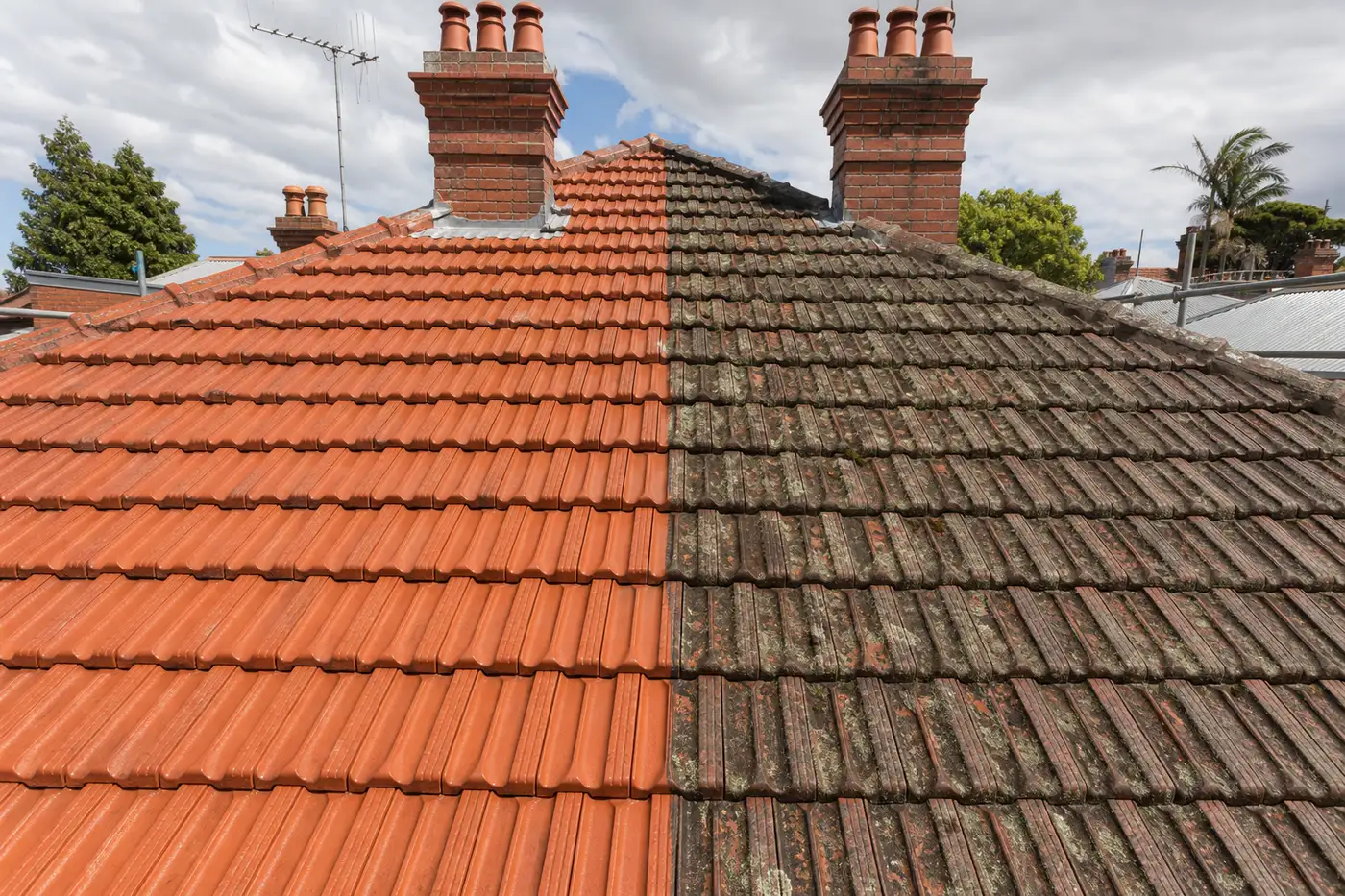 Interwar terracotta tile roof in Melbourne's north, one side restored and one side weathered