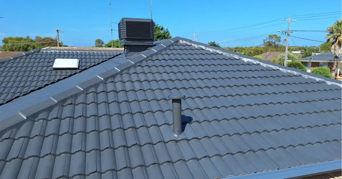 Concrete tile roof restored and recoated in charcoal — Roof Restoration Services Northern Suburbs Melbourne